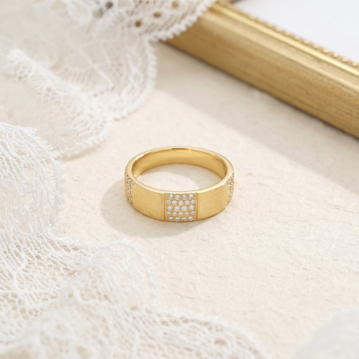 Gold-plated S925 sterling silver dome ring on a light fabric setting