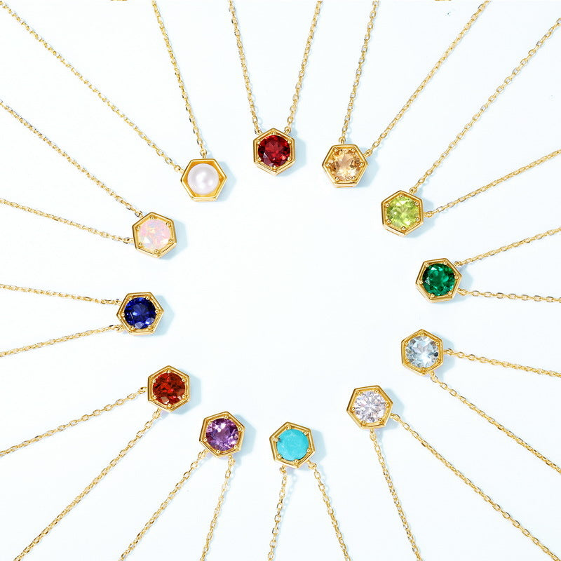 Twelve hexagon birthstone necklaces arranged in a circle