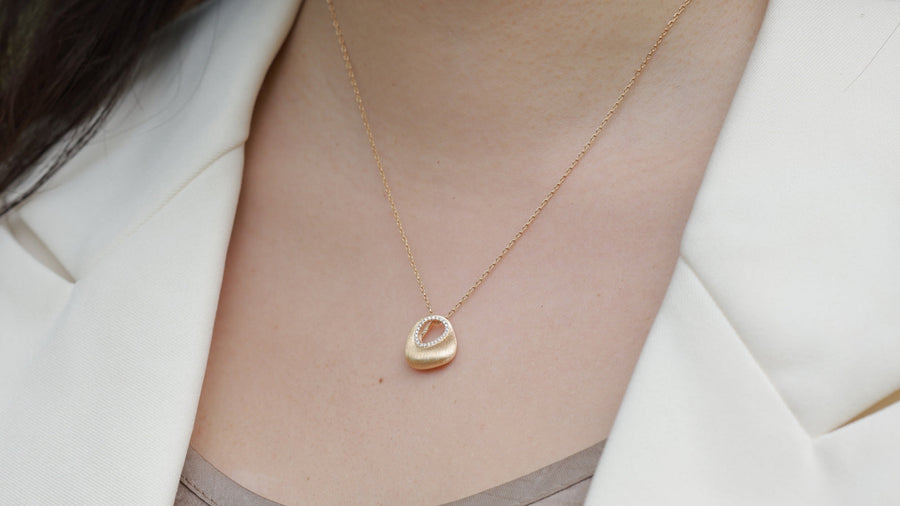 Gold-plated sterling silver necklace worn against the skin