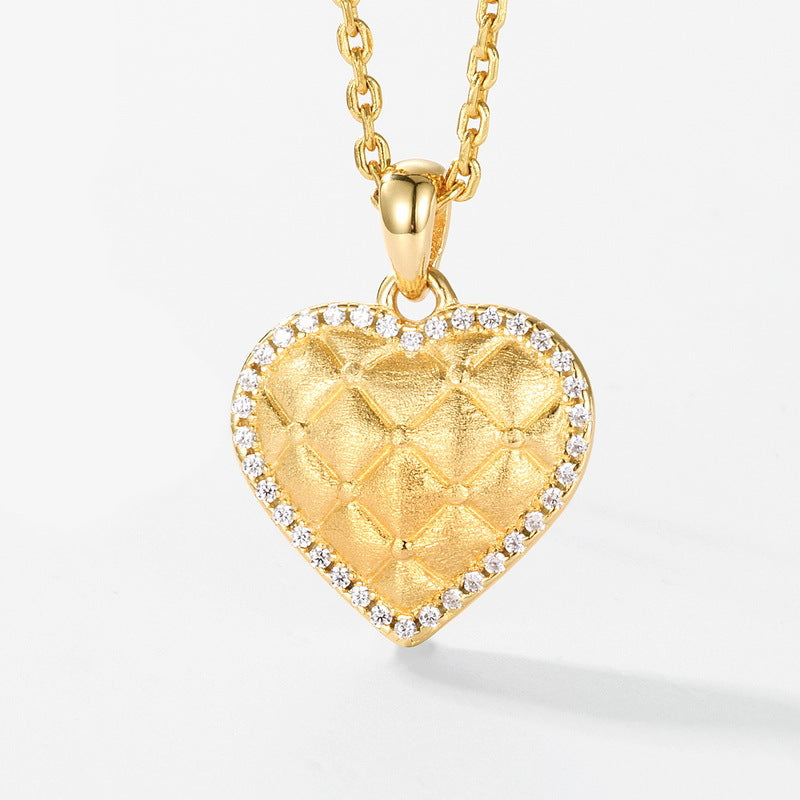 Close-up of the heart pendant bail and gold-plated chain