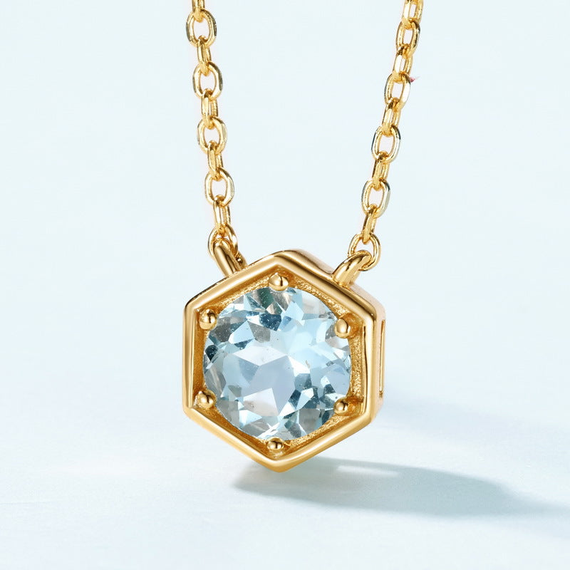 Aquamarine hexagon pendant necklace in a pale blue styled setting